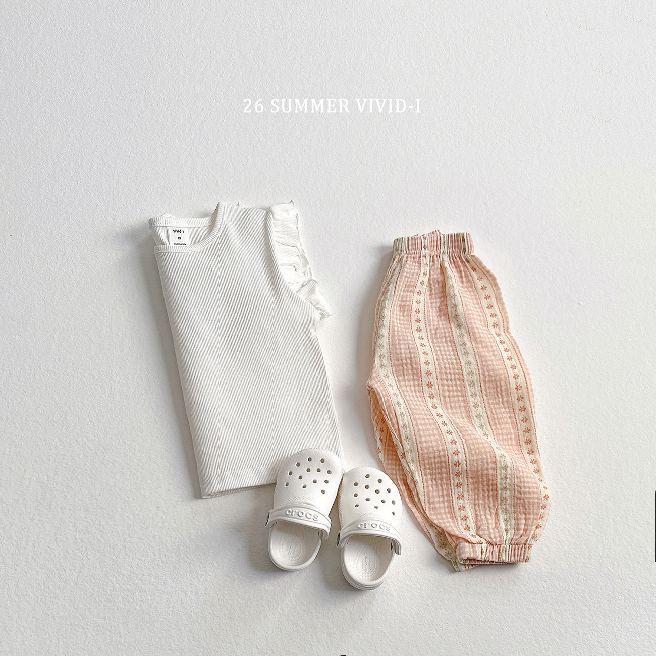 【PREORDER受付終了、ご希望はお問い合わせください。】77.Rib Frill Sleeveless Top