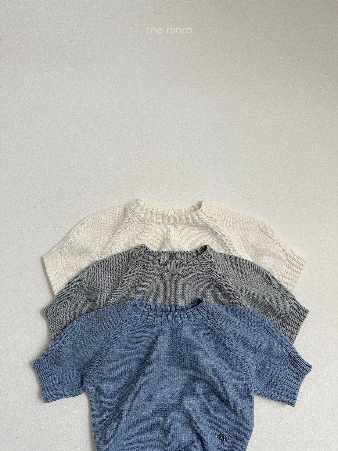 28.Emblem 3/4 Sleeve Knit Top