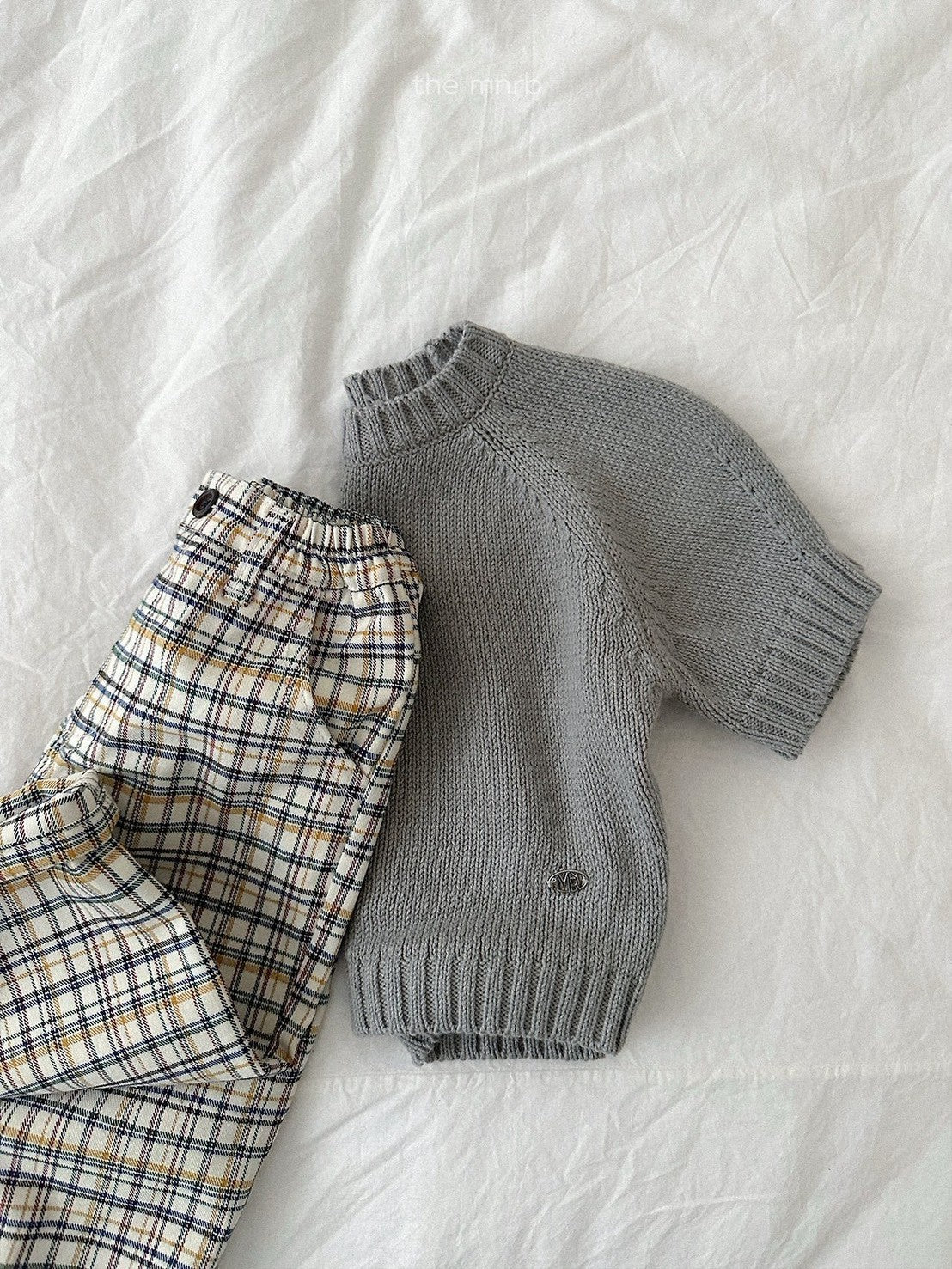 28.Emblem 3/4 Sleeve Knit Top