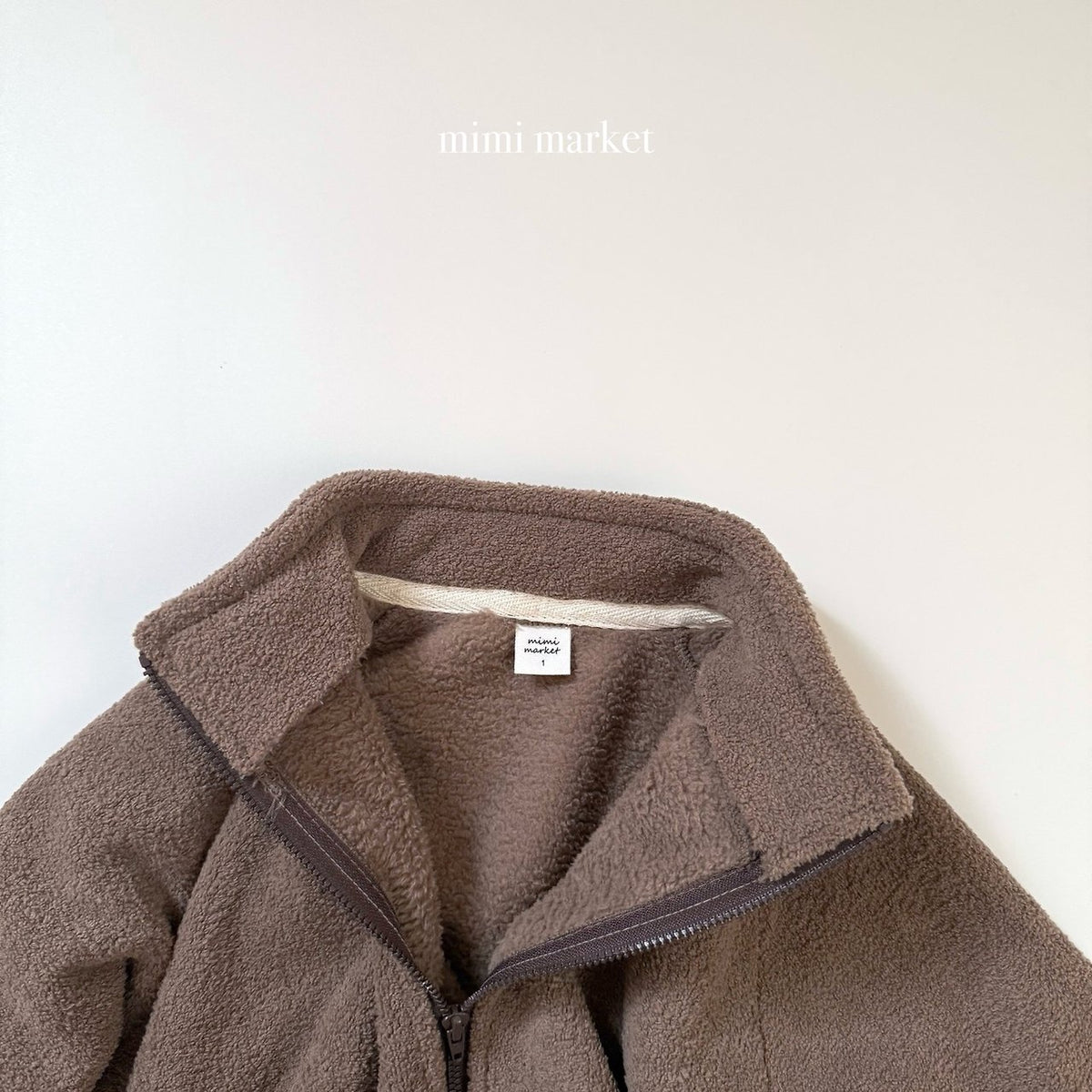 ［mimimarket］egg zip-up